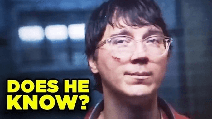 A man with glasses gives a faint knowing smile beside large yellow baked text reading “Does he know?” on a dark blue background.