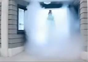 Figure Emerging Through Smoke