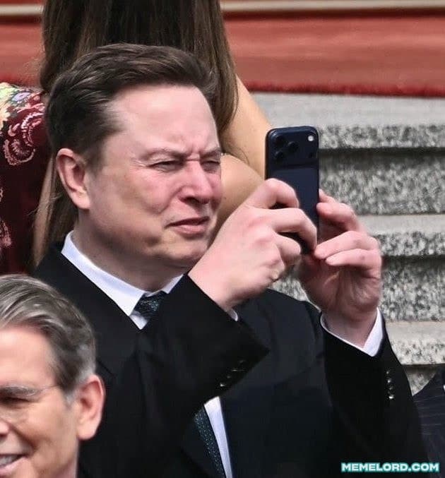 Elon Musk staring at a phone meme template