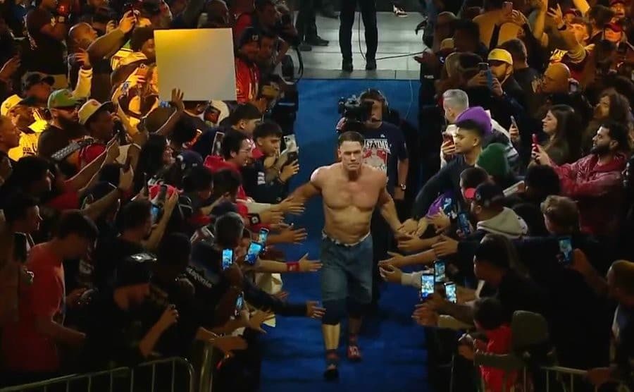John Cena high-fiving fans
