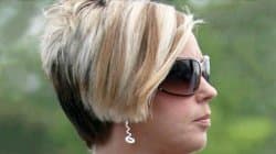 Stock photo of a middle-aged blonde woman with an angled short haircut and an entitled, confrontational expression