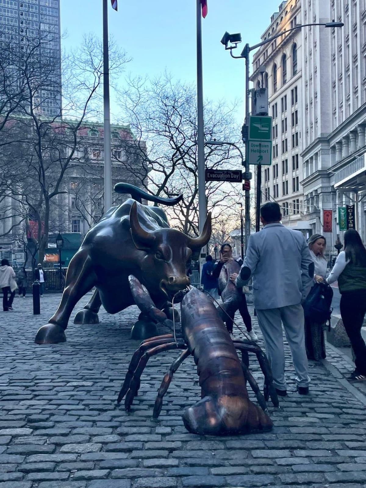 Lobster statue next to Wall Street Charging Bull