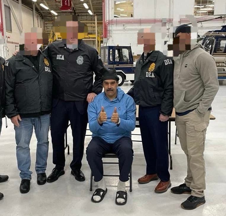 Maduro giving thumbs up in handcuffs alongside DEA agents