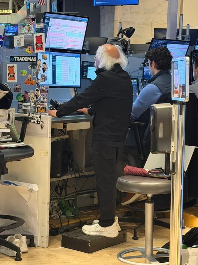 Peter Tuchman trading at his multi-monitor desk