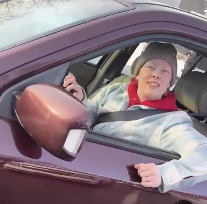 Renee Good smiling inside car