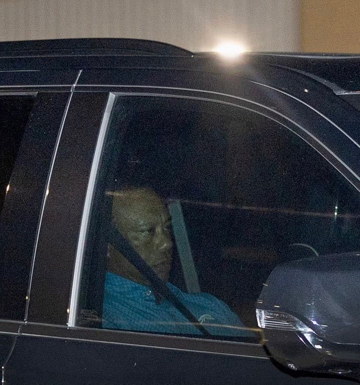 Tiger Woods leaving Jail in a car side angle meme template