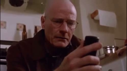 Walter White Looking at Phone
