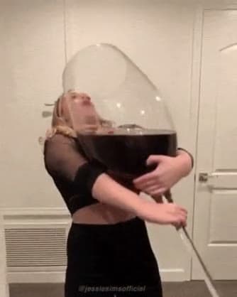 Woman Hiding Behind Giant Wine Glass