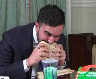 Zohran Mamdani devouring his crunch wrap supreme meme template