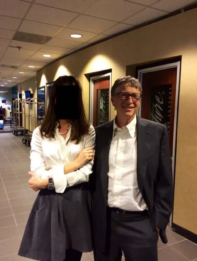 Bill Gates With A Woman In A Hallway
