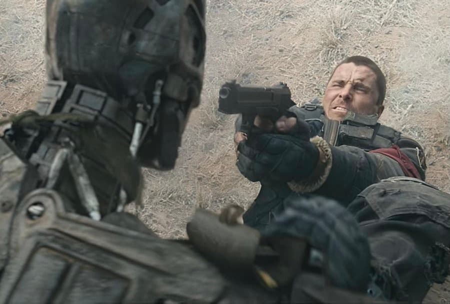 Christian Bale pointing a gun at a Robot - Terminator Salvation
