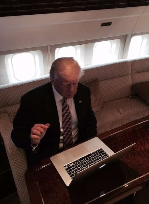 Donald Trump typing on laptop