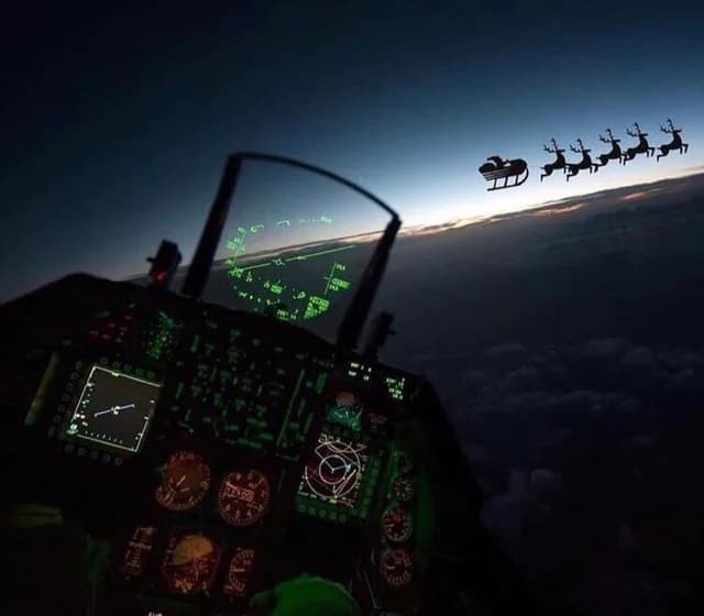Fighter jet's HUD locking onto Santa's sleigh in the night sky