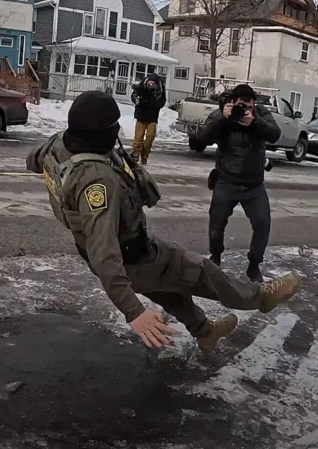 ICE agent slips on ice