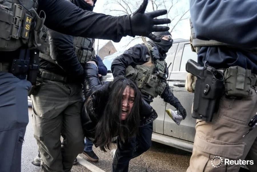 ICE agents in Minneapolis dragging a woman from her car