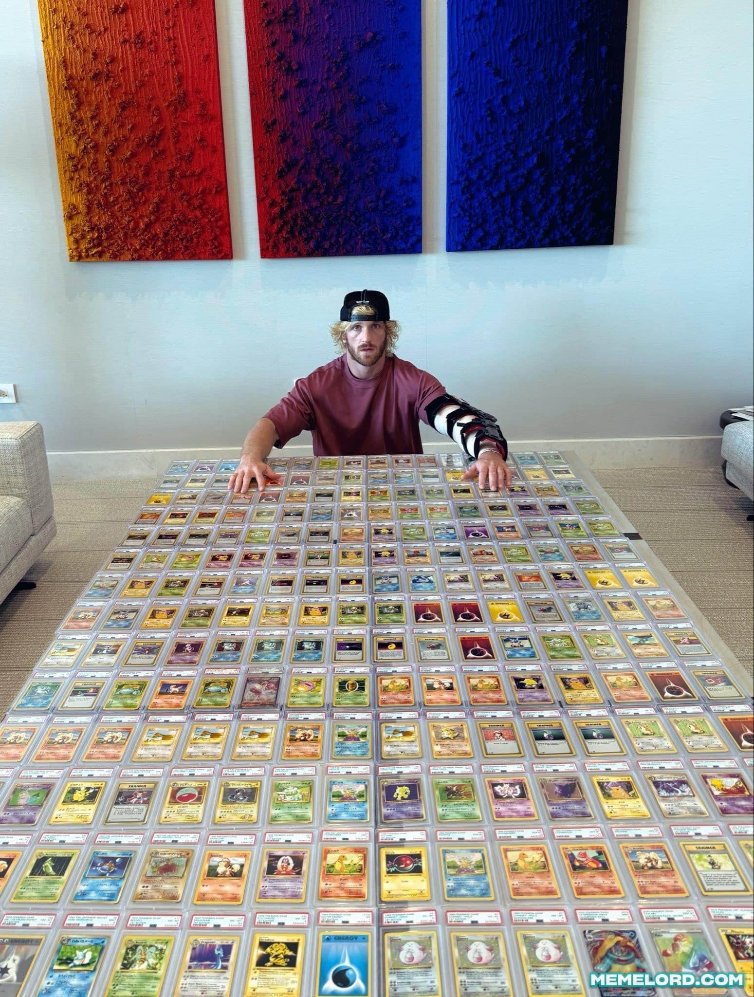 Logan Paul Pokémon card collection - recreates Floyd Mayweather’s money shot meme template