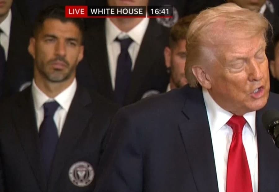 Luis Suarez staring at Donald Trump from behind