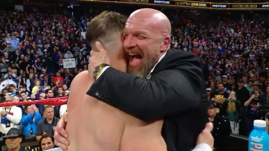 Triple H hugging John Cena