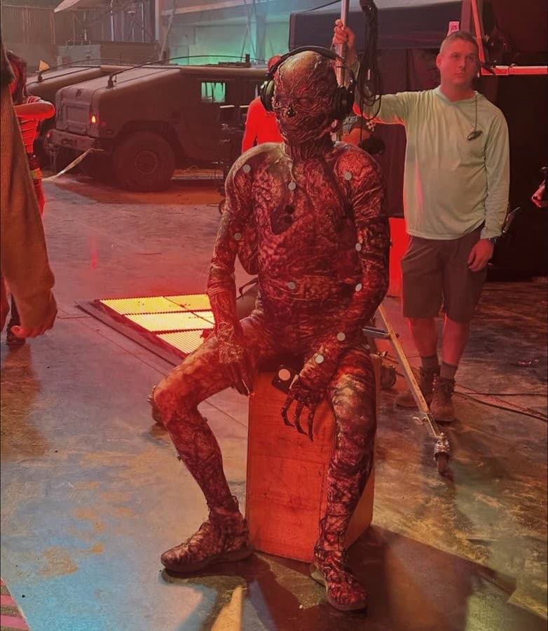 Vecna seated with headphones on the Stranger Things season 5 set