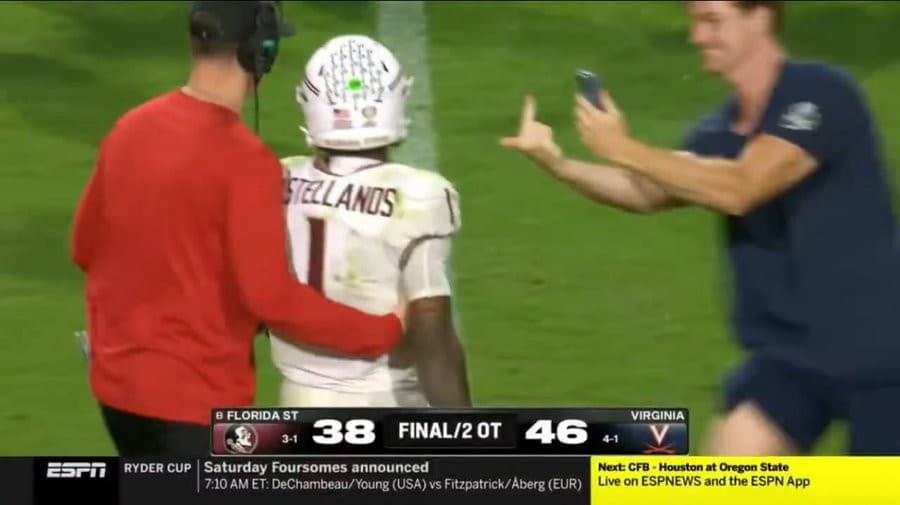 Virginia fan flipping off a Florida State player