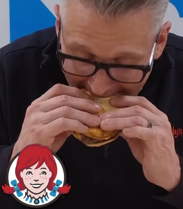 Wendy’s US President Burger taking few bites of a Wendy’s burger